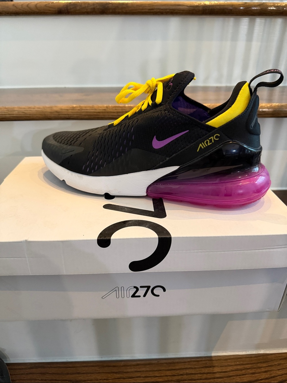 Nike Black Shoe with Purple Swoosh and Yellow Accents